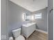 Bathroom features a double vanity and neutral grey walls at 3220 Newton Ave, Indianapolis, IN 46201