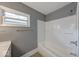 Bathroom features an extended tub and shower with neutral walls at 3220 Newton Ave, Indianapolis, IN 46201