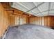 Spacious garage featuring unfinished walls, a white ceiling, and concrete floor perfect for parking or storage at 3220 Newton Ave, Indianapolis, IN 46201