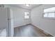 Bright kitchen with modern laminate flooring and natural light from two windows at 3220 Newton Ave, Indianapolis, IN 46201