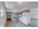 Updated kitchen featuring stainless steel appliances and gray cabinets with neutral flooring at 3220 Newton Ave, Indianapolis, IN 46201