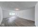 Spacious living room with neutral walls and flooring, providing a clean and open feel at 3220 Newton Ave, Indianapolis, IN 46201