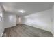 Spacious living room featuring modern flooring, fresh white walls, and ample natural light at 3220 Newton Ave, Indianapolis, IN 46201