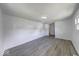 Bright living room with modern floors and fresh, white walls, offering a clean and inviting space at 3220 Newton Ave, Indianapolis, IN 46201