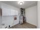 Utility room features modern flooring, water heater and plumbing at 3220 Newton Ave, Indianapolis, IN 46201