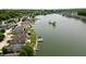 Aerial view of lakeside properties with private docks, showcasing the community's scenic waterfront setting at 3404 Maritime Dr, Indianapolis, IN 46214