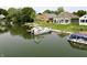 Waterfront view of the back of the home with a boat docked in the water at 3404 Maritime Dr, Indianapolis, IN 46214
