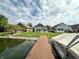 Home backyard with waterfront access and backyard patio seating at 3404 Maritime Dr, Indianapolis, IN 46214