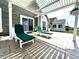 Serene backyard patio with pergola, lounge chairs, and sliding glass doors for indoor-outdoor living at 3404 Maritime Dr, Indianapolis, IN 46214
