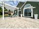 Spacious backyard patio with outdoor seating, lush green lawn, and lake view at 3404 Maritime Dr, Indianapolis, IN 46214