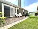 Charming backyard patio with outdoor seating, lake view, and lush green lawn at 3404 Maritime Dr, Indianapolis, IN 46214