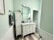 Bathroom featuring a vanity with a sink, vanity mirror, and modern fixtures at 3404 Maritime Dr, Indianapolis, IN 46214