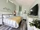 Comfortable bedroom featuring stylish decor, a ceiling fan, and ample natural light at 3404 Maritime Dr, Indianapolis, IN 46214