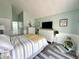 A cozy bedroom with a modern decor, natural light, and sleek, stylish furnishings at 3404 Maritime Dr, Indianapolis, IN 46214