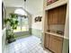 Bright breakfast nook features a large window, chandelier, and tiled floors at 3404 Maritime Dr, Indianapolis, IN 46214