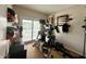 Exercise room with sliding glass door access to the lake and an assortment of exercise equipment at 3404 Maritime Dr, Indianapolis, IN 46214