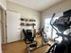 Exercise room overlooking the lake featuring modern equipment and sliding glass door at 3404 Maritime Dr, Indianapolis, IN 46214