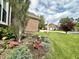 Beautifully landscaped front yard with vibrant flowers and lush green lawn with an inviting curb appeal at 3404 Maritime Dr, Indianapolis, IN 46214