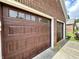 Close-up of beautifully finished double garage doors with decorative windows, showcasing craftsmanship at 3404 Maritime Dr, Indianapolis, IN 46214