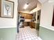 Hallway view of the kitchen with stainless steel appliances and white backsplash at 3404 Maritime Dr, Indianapolis, IN 46214