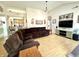 Open-concept living room with kitchen view, hardwood floors, and inviting decor at 3404 Maritime Dr, Indianapolis, IN 46214