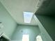 Skylight letting natural light into the bathroom, and textured ceiling at 3404 Maritime Dr, Indianapolis, IN 46214