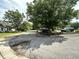 Street view showing mature trees and well-maintained landscaping, enhancing the neighborhood's beauty at 3404 Maritime Dr, Indianapolis, IN 46214