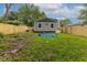 View of the backyard, new privacy fence, and back of home at 3614 N Whittier Pl, Indianapolis, IN 46218