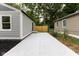 Backyard patio featuring a modern gray siding and a new wooden fence at 3614 N Whittier Pl, Indianapolis, IN 46218
