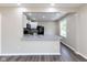 Modern kitchen with stone countertops and an open view to the living room at 3614 N Whittier Pl, Indianapolis, IN 46218