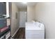 Laundry room with modern washer and dryer appliances and access to a door at 3614 N Whittier Pl, Indianapolis, IN 46218