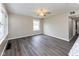 Open Living room with a ceiling fan and a window offering outside views at 3614 N Whittier Pl, Indianapolis, IN 46218