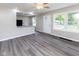Open-concept living room with lots of natural light and modern floors at 3614 N Whittier Pl, Indianapolis, IN 46218