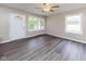 Bright living room with large windows and neutral wall paint at 3614 N Whittier Pl, Indianapolis, IN 46218