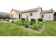 Expansive backyard with mature landscaping, a patio, and a well-manicured lawn at 3645 Richland Dr, Columbus, IN 47203