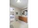 Bright bathroom with a double sink vanity and views into the Primary bedroom at 3645 Richland Dr, Columbus, IN 47203