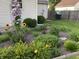 Beautiful flower garden, a bird statue, and sunflowers in the backyard at 3645 Richland Dr, Columbus, IN 47203