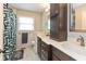 Bathroom with dual sinks, quartz countertop, modern fixtures, and ample storage at 3713 Coventry Way, Carmel, IN 46033
