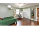 Spacious bedroom with hardwood floors, a desk, cat tree, and dresser at 3713 Coventry Way, Carmel, IN 46033
