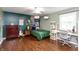 Inviting bedroom with hardwood floors, desk area, and a cat tree at 3713 Coventry Way, Carmel, IN 46033