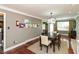 View of dining room with modern light fixture and lots of natural light at 3713 Coventry Way, Carmel, IN 46033