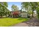Attractive home showcasing a well-manicured lawn and a driveway leading to the side, offering ample parking at 3713 Coventry Way, Carmel, IN 46033
