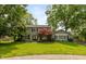 Charming two-story home with lush green lawn and mature trees, creating a welcoming curb appeal at 3713 Coventry Way, Carmel, IN 46033