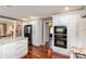 Modern kitchen featuring stainless steel appliances, white cabinets, hardwood floors, and granite countertops at 3713 Coventry Way, Carmel, IN 46033