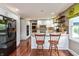 Gourmet kitchen with island seating, stainless steel appliances, and white cabinets, ideal for culinary enthusiasts at 3713 Coventry Way, Carmel, IN 46033