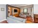 Inviting living room with a stone accent wall, custom built-ins, and comfortable seating, perfect for relaxation at 3713 Coventry Way, Carmel, IN 46033