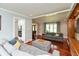 Open-concept living area with hardwood floors and a view of the kitchen, creating a seamless flow for entertaining at 3713 Coventry Way, Carmel, IN 46033