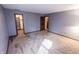 Bedroom with neutral walls, carpeted floor, with open door to walk in closet at 3819 S Village Dr, New Palestine, IN 46163