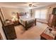 This is an image of the bedroom with a spacious layout, ceiling fan, and lots of natural light at 3819 S Village Dr, New Palestine, IN 46163