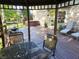 Outdoor oasis with a large deck, gazebo, hot tub, and comfortable seating perfect for entertaining and relaxing at 3819 S Village Dr, New Palestine, IN 46163